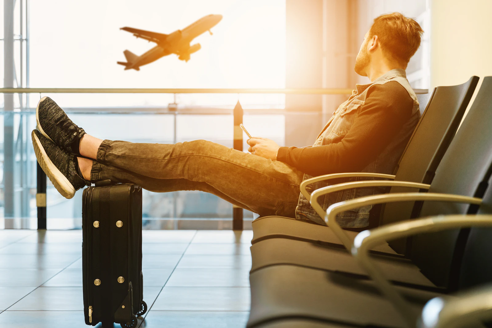 Traveller waiting at an airport terminal